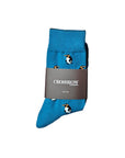 Arctic March Organic Cotton Socks in blue with playful penguin design, made from sustainable organic cotton blend.