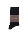 Classic Black Organic Cotton Socks folded with a brown Crossrow London label, made for comfort and durability.