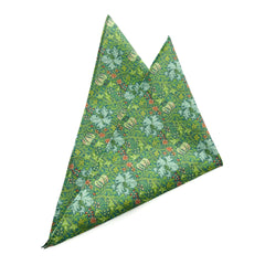 Golden Lily Verdant Pocket Square with green backdrop and intricate floral designs in blue, red, and gold.