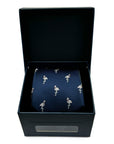 Navy woven polyester tie with pink flamingo pattern, displayed inside a black gift box for formalwear.