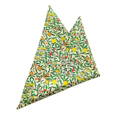 Pomegranate Ivory pocket square with lush green leaves and warm fruit accents on an ivory background.