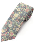 Floral cotton tie with blush, peach, sage, and ivory flowers on a muted charcoal background for smart occasions.