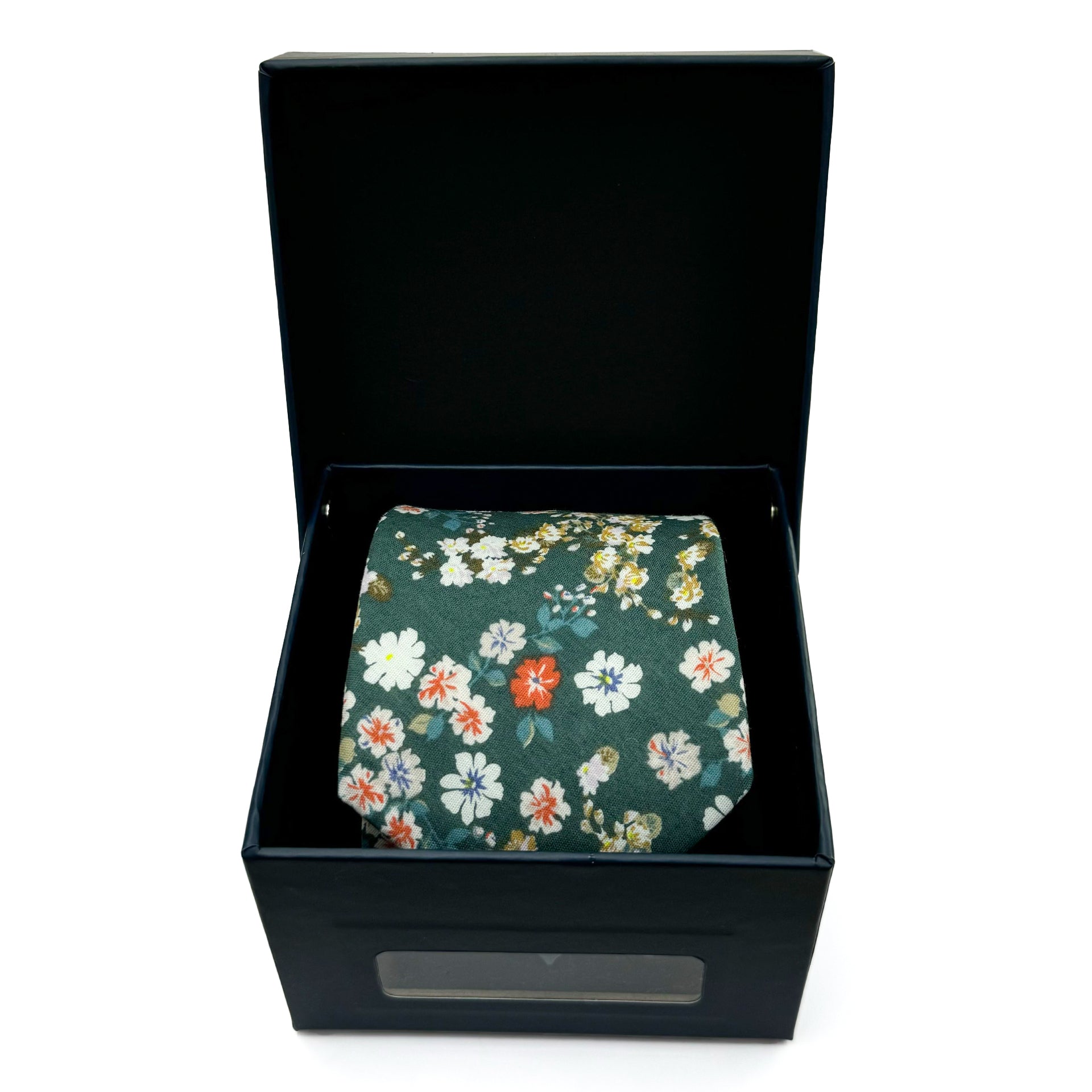 Green floral cotton tie with white and orange flowers, presented in a black gift box for weddings or garden parties.