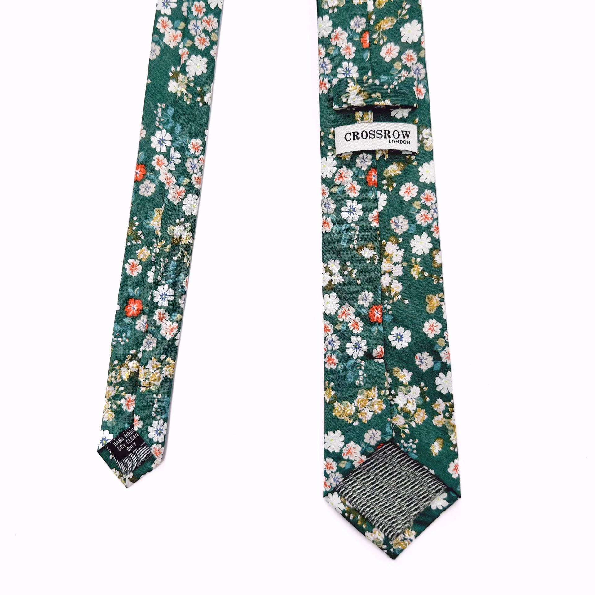 Green floral cotton tie with white and orange flowers, handmade with a matte finish for spring and summer style.