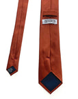 Burnt orange men's silk tie showcasing luxurious mulberry silk and elegant design for formal occasions.