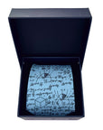 Light blue polyester tie with mathematical equations and shapes, displayed folded inside a black gift box.