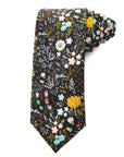 Cotton tie with bold floral pattern in mustard yellow, lilac, blue, and blush on a black background for formal occasions.