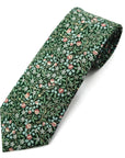 Deep green cotton tie with intricate white blossoms and red clover pattern inspired by William Morris design.