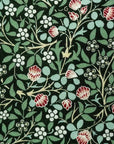 Close-up of Clover Grove Cotton Tie fabric with green background and red, white floral William Morris pattern.