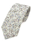 Elegant floral men's tie with blue and lilac flowers on a soft neutral background, perfect for spring and summer formalwear.