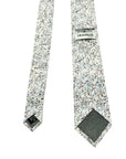 English Garden Mist men's tie featuring floral design with blue, lilac flowers and neutral tones, perfect for spring and summer.