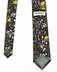 Black cotton tie with vibrant mustard, lilac, blue, and blush floral patterns by Crossrow London