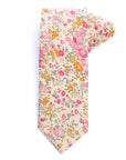 Cotswold Bloom tie with a floral pattern in pink, orange, and yellow on a beige background.