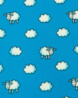Close-up of sky-blue polyester tie pattern featuring fluffy white clouds and playful cartoon sheep.