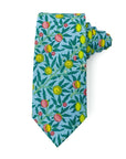 tie with yellow and pink fruit pattern on a blue background, 3 inches wide, 58 inches long, 100% cotton.