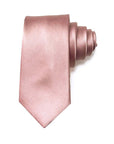 Dusty pink men's silk tie rolled up, made from pure mulberry silk, perfect for formal events.