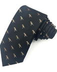 The Dino Classic Polyester Tie featuring gold dinosaur motifs on a black background, perfect for stylish statements.