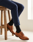 Midnight Dot Organic Cotton Socks worn with cuffed navy chinos and tan brogues