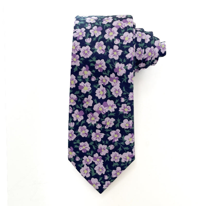 Lilac Grove tie with delicate lilac flowers on a deep navy background.