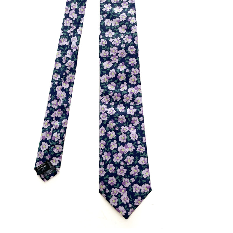 Lilac Grove tie with delicate lilac flowers on a deep navy background.