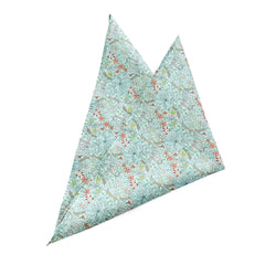 Golden Lily Sage pocket square with floral design in green, blue, and red on a light backdrop, made from breathable cotton.