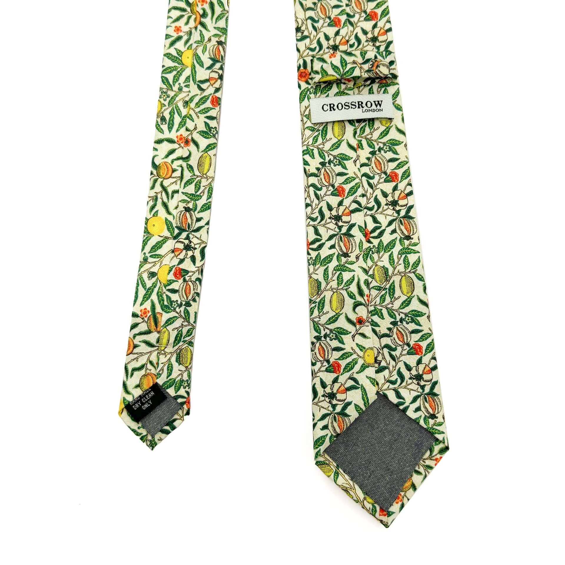 Pomegranate Ivory men&#39;s tie featuring William Morris design with lush foliage and fruits in ivory and green colors.