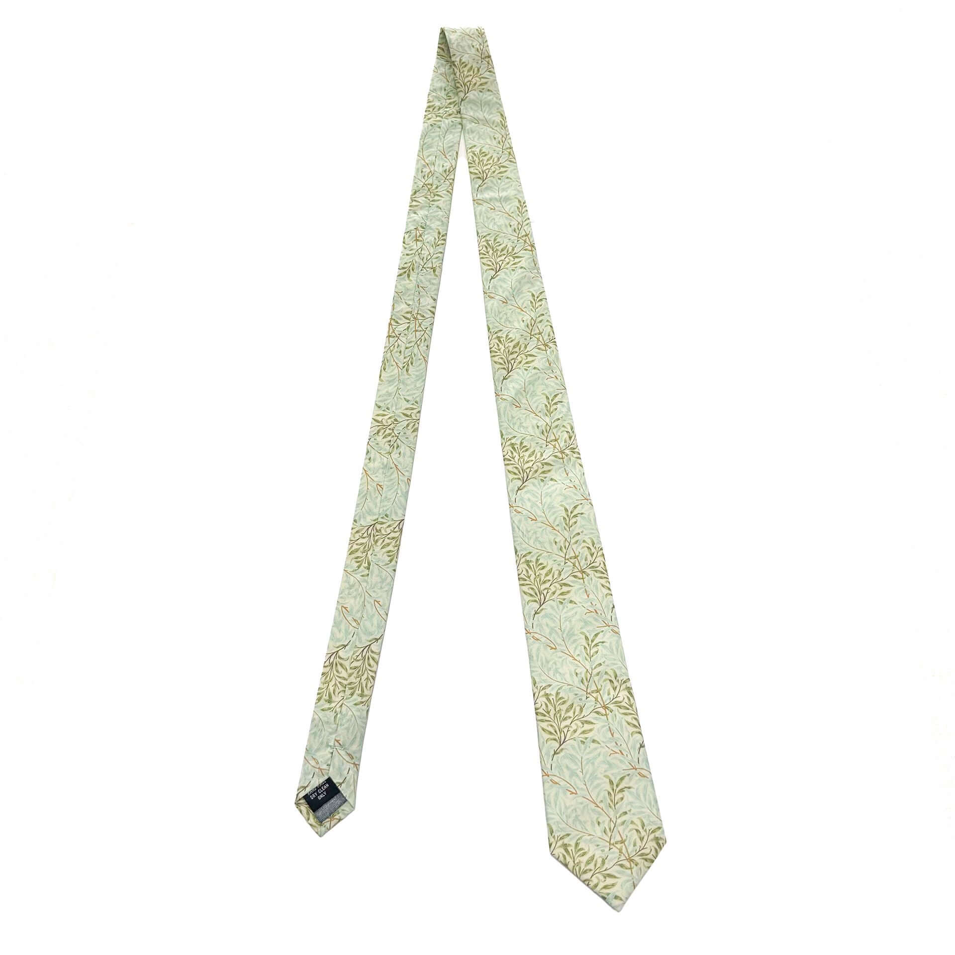 Willow Mist tie showcasing elegant leaf motifs in pastel sage and cream, handcrafted from breathable cotton.