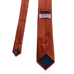 Burnt orange men's silk tie showcasing luxurious mulberry silk and elegant design for formal occasions.