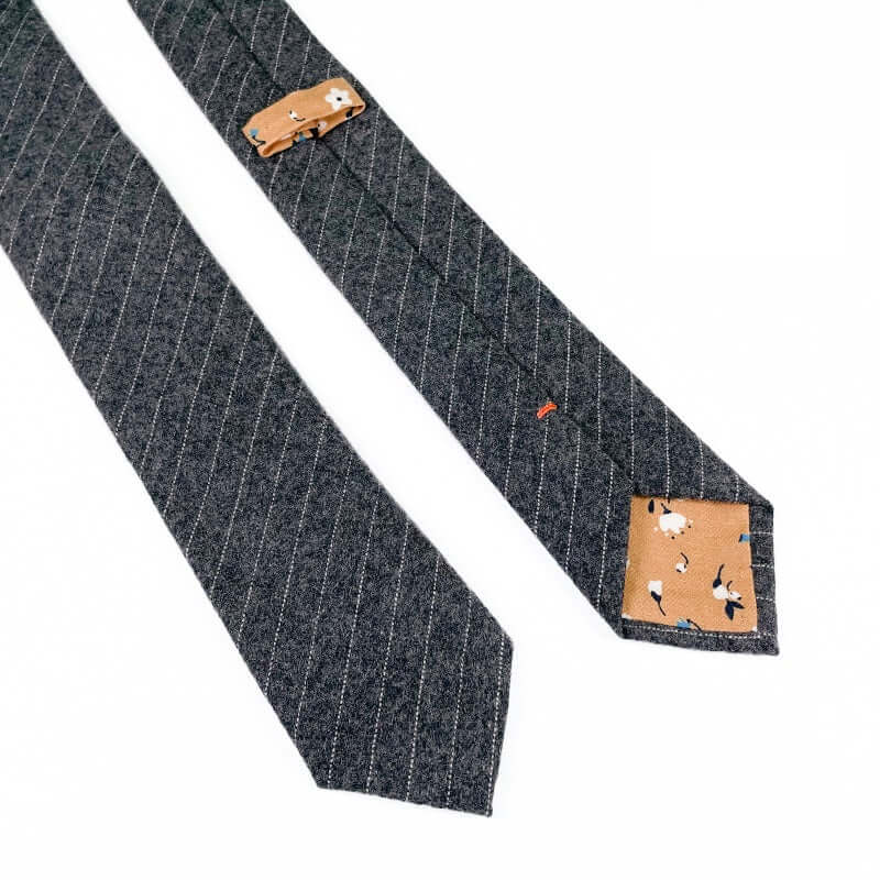 Charcoal striped wool tie with floral contrast tip, perfect for a stylish winter accessory.