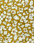 Close-up of the Feather Meadow Yellow Liberty Tana Lawn tie showing the floral detail.