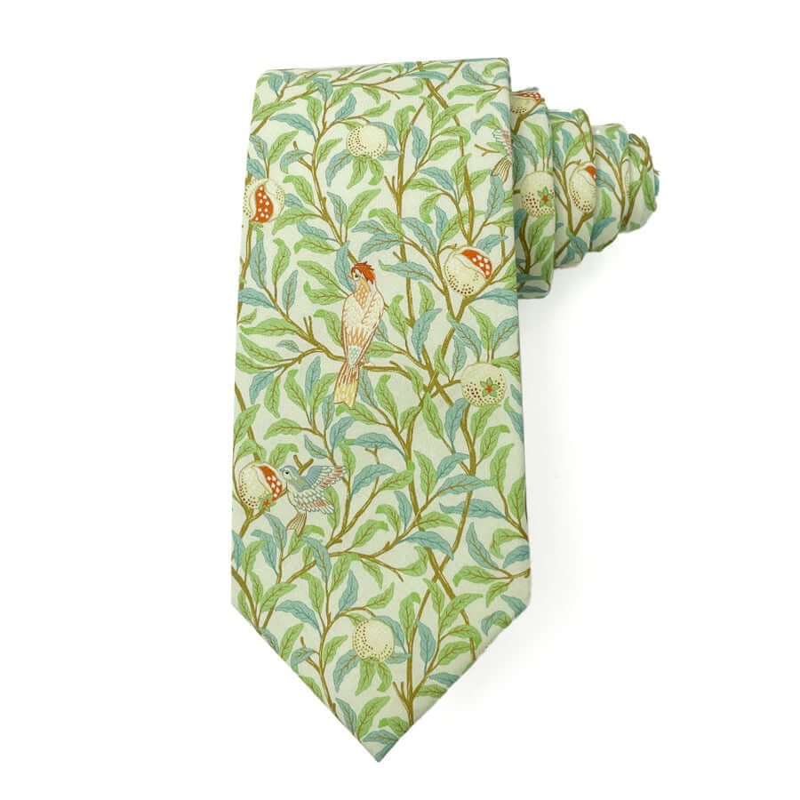 Songbird Garden tie with bird and foliage design in green and beige, 3 inches wide, 58 inches long, 100% cotton.