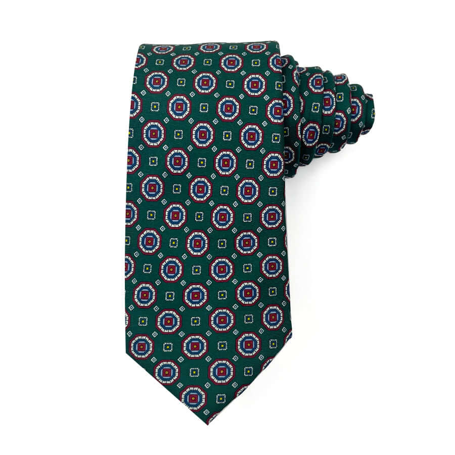 silk tie with a geometric pattern in green, red, and blue, 100% silk.