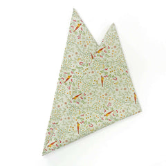 Newill design pocket square featuring an intricate pattern of birds, leaves, and floral elements, neatly folded.