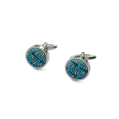 Cufflinks with a turquoise background featuring a detailed dragonfly pattern.