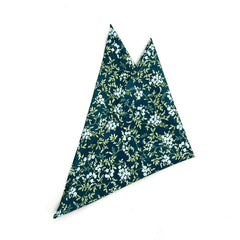 Mayfair Floral Pocket Square featuring a deep green base with delicate blue floral accents, ideal for formal and casual attire.