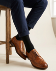 Classic Black Organic Cotton Socks worn with cuffed navy chinos and tan brogues